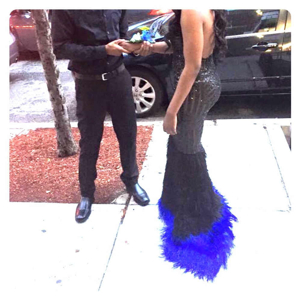 Custom made dress with trail made out of feathers